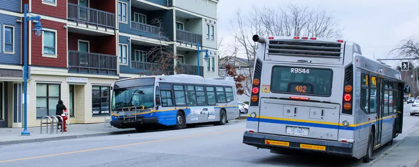 Two buses stopped at the Steveston Village