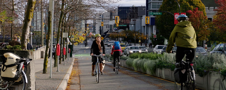 People biking in both directions in a dedicated bike lane