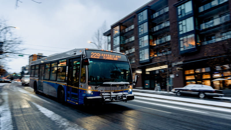 229 Lonsdale Quay driving on Lonsdale Avenue on a snowy day.'